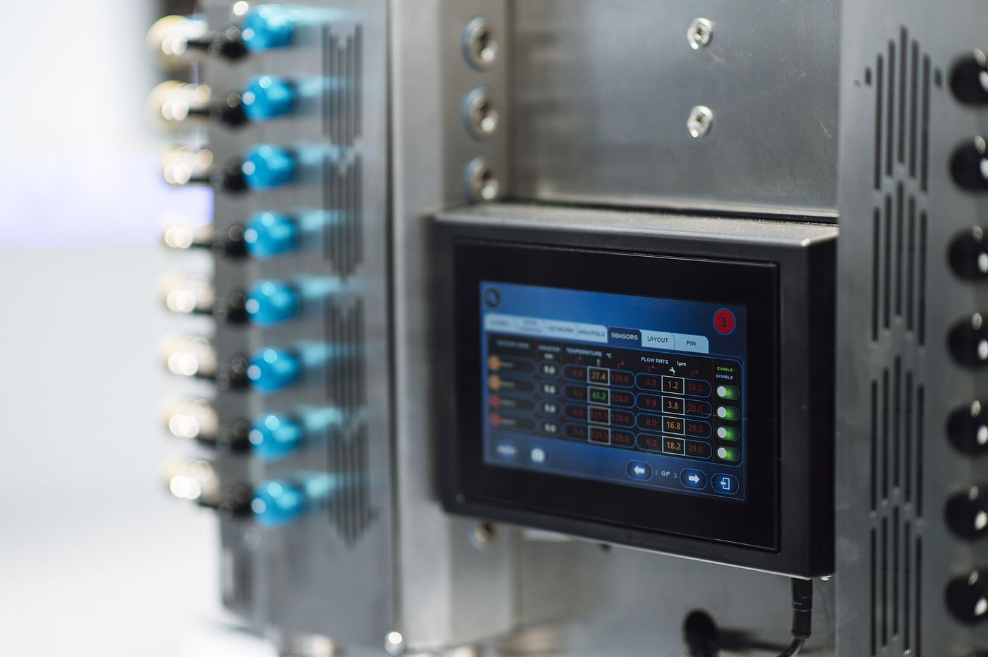 The touchscreen control panel on an industrial machine, showing readings and set points.